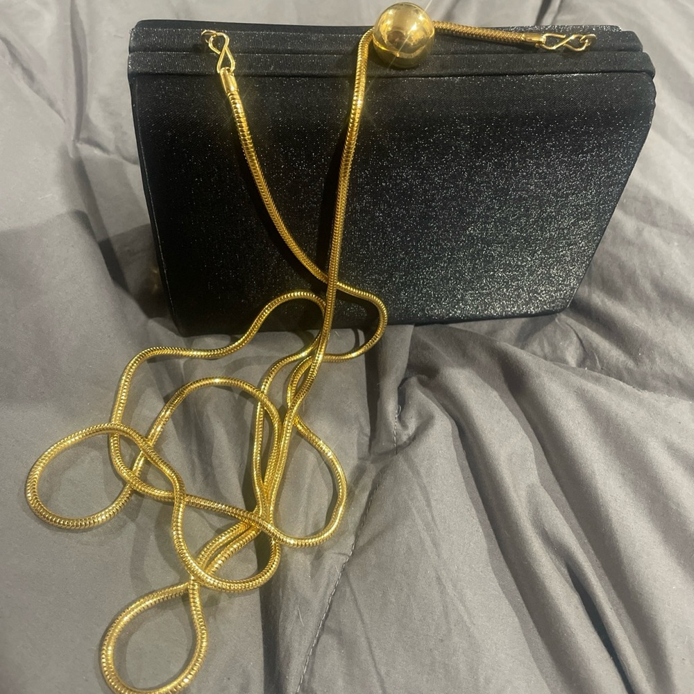 Small Valerie Steven’s black clutch with gold chain